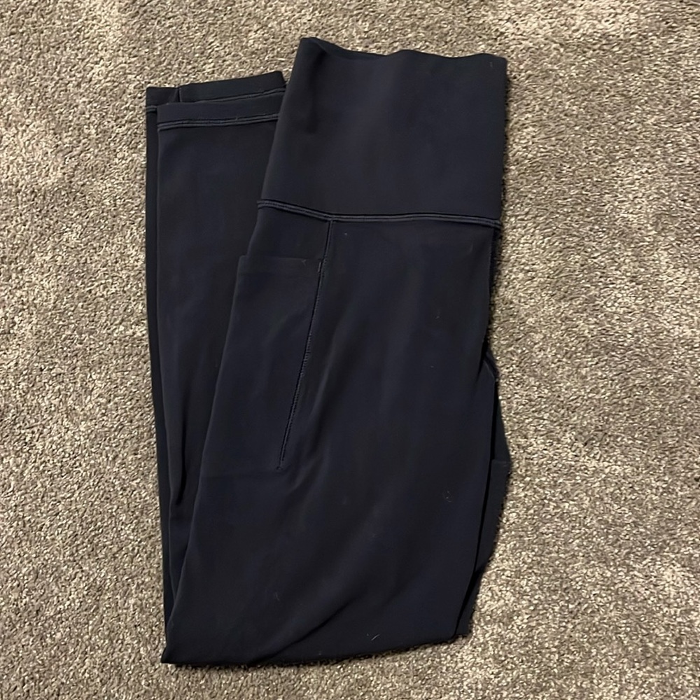 Athleta salutation stash pocket II 7/8 tight